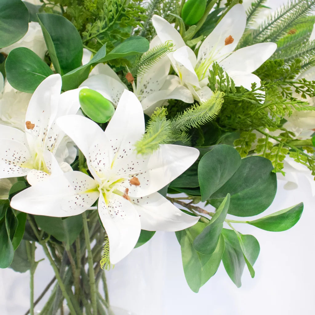 WHITE TIGER LILY WITH FERN FOLIAGE IN CYLINDER VASE 70cm